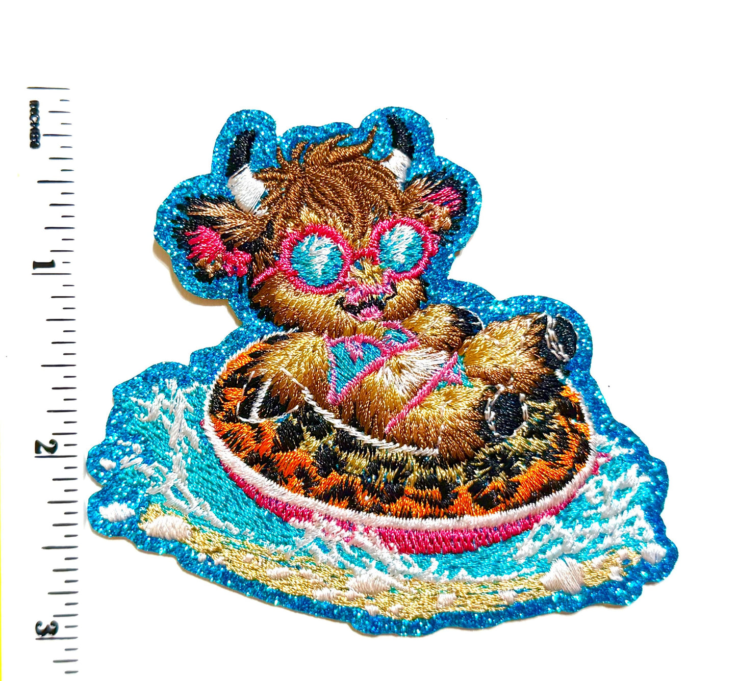 Highland Cow on a pool Float - Embroidered Patch with blue glitter 3.5”