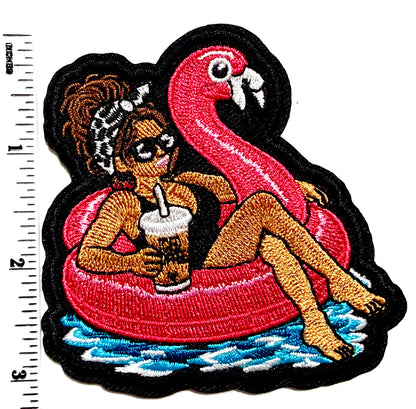 Girl with Messy Bun on a Flamingo Pool Float patch - Embroidered DIY Iron-On Applique 3”