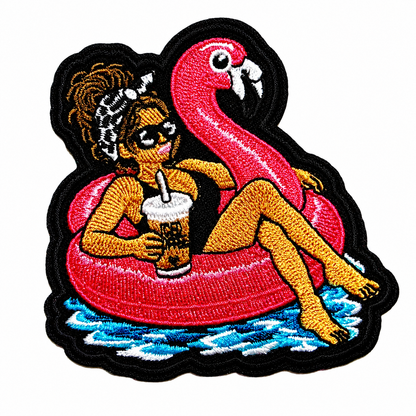 Girl with Messy Bun on a Flamingo Pool Float patch - Embroidered DIY Iron-On Applique 3”