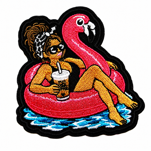 Girl with Messy Bun on a Flamingo Pool Float patch - Embroidered DIY Iron-On Applique 3”